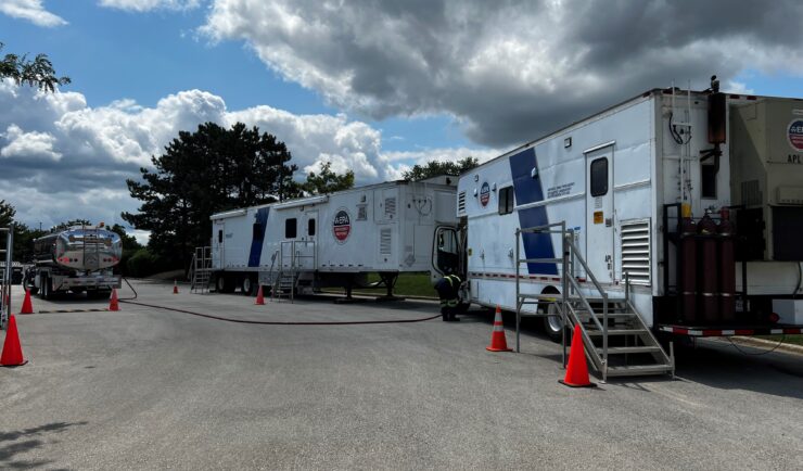 tractor trailers stationed in a parking lot