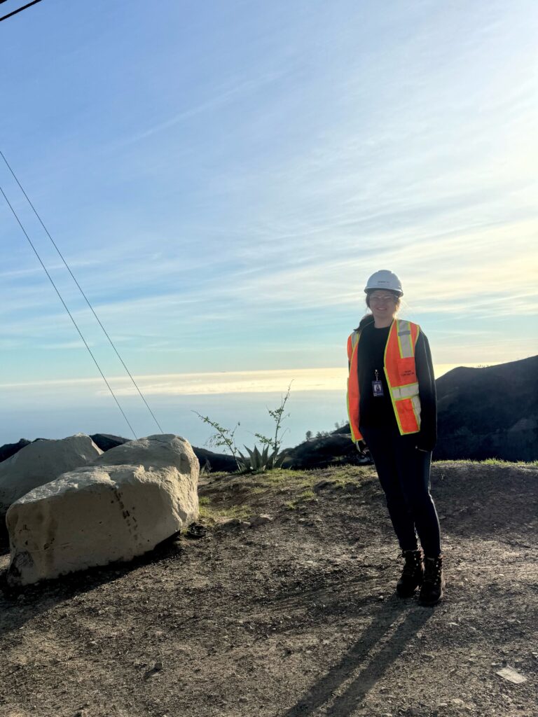 Woman stands on a hill